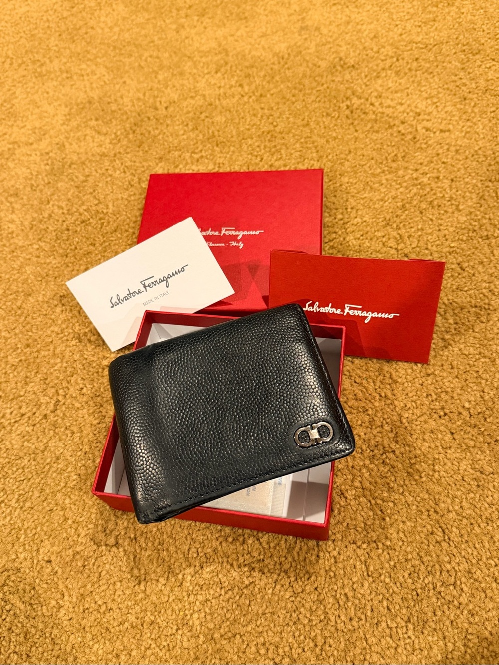 Salvatore Ferragamo Black Pebbled Leather Bi-Fold Wallet with Metal Logo